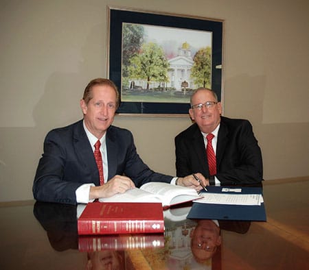 Attorneys Michael K. Ruberg and Donald J. Ruberg sitting at a table