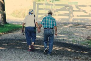 Elderly couple holding hands, walking in Crestview Hills, Kentucky